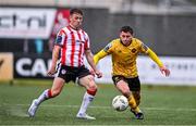 21 July 2024; Kian Leavy of St Patrick's Athletic in action against Ben Doherty of Derry City during the Sports Direct Men’s FAI Cup second round match between Derry City and St Patrick’s Athletic at the Ryan McBride Brandywell Stadium in Derry. Photo by Ben McShane/Sportsfile