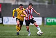 21 July 2024; Kian Leavy of St Patrick's Athletic in action against Ben Doherty of Derry City during the Sports Direct Men’s FAI Cup second round match between Derry City and St Patrick’s Athletic at the Ryan McBride Brandywell Stadium in Derry. Photo by Ben McShane/Sportsfile