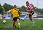 21 July 2024; Ben Doherty of Derry City in action against Kian Leavy of St Patrick's Athletic during the Sports Direct Men’s FAI Cup second round match between Derry City and St Patrick’s Athletic at the Ryan McBride Brandywell Stadium in Derry. Photo by Ben McShane/Sportsfile