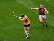 21 July 2024; Tony Kelly of Clare scores a point over his shoulder despite the challenge of Ethan Twomey of Cork during the GAA Hurling All-Ireland Senior Championship Final between Clare and Cork at Croke Park in Dublin. Photo by Daire Brennan/Sportsfile