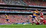 21 July 2024; Tony Kelly of Clare, right, collides with Cork goalkeeper Patrick Collins after scoring their side's third goal during the GAA Hurling All-Ireland Senior Championship Final match between Clare and Cork at Croke Park in Dublin. Photo by Seb Daly/Sportsfile