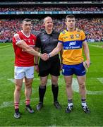21 July 2024; Referee Johnny Murphy with the two captains, Sean O'Donoghue of Cork and Tony Kelly of Clare before the GAA Hurling All-Ireland Senior Championship Final between Clare and Cork at Croke Park in Dublin. Photo by Ray McManus/Sportsfile