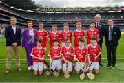 21 July 2024; The Cork team, back row from left, Evan Diggin, Scoil Chríost Rí, Tralee, Kerry, Dylan Kelly, St Brigid's NS, Bagnalstown, Carlow, Conor Ho Flynn, St Joseph's BNS, Terenure Road, Bobby Moore, St Pius X BNS, Terenure, Dublin, Riain Casey, Our Lady of Mercy NS, Stradbally, Waterford, and front row, Liam Meade, Ballyfin NS, Ballyfin, Laois, Sean Quinn, St John's PS, Swatragh, Derry, Flynn Hasson, Roan St Patrick's Eglish, Dungannon, Tyrone, Liam McKenna, Coachford NS, Coachford, Cork, and Shay Mallie, Scoil Mhuire na mBuachaillí, Monaghan, with from left, Uachtarán an Cumann Camógaíochta Brian Molloy, INTO President Carmel Browne, Uachtarán Chumann Lúthchleas Gael Jarlath Burns and President of Cumann na mBunscol Gary Farrell before the GAA INTO Cumann na mBunscol Respect Exhibition Go Games at the GAA Hurling All-Ireland Senior Championship final between Clare and Cork at Croke Park in Dublin. Photo by Sam Barnes/Sportsfile