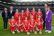 21 July 2024; The Cork team, backrow from left, Paige Russell, Holy Trinity SNS, Donaghmeade, Dublin, Sophie Bridgeman, St Fiachra's SNS, Beaumont, Dublin, Annie Rose Hogan, Coolderry NS, Birr, Offaly, Kallie Herbert, Lanesboro NS, Lanesboro, Longford, and Niamh McGarry, St Mary's PS, Portaferry, Down, and front row from left, Millie Allen, Riverstown NS, Glanmire, Cork, Sadhbh Spillane, Abbeydorney NS, Abbeydorney, Kerry, Fia Conroy, Scoil an Fhraoich Mhóir, Portlaoise, Laois, Amelia O'Donovan, Glenville NS, Glenville, Cork, and Emma Kelly, Church Hill NS, Cuffesgrange, Kilkenny, with from left, President of Cumann na mBunscol Gary Farrell, Uachtarán an Cumann Camógaíochta Brian Molloy, Uachtarán Chumann Lúthchleas Gael Jarlath Burns and INTO President Carmel Browne,  before the GAA INTO Cumann na mBunscol Respect Exhibition Go Games at the GAA Hurling All-Ireland Senior Championship final between Clare and Cork at Croke Park in Dublin. Photo by Sam Barnes/Sportsfile
