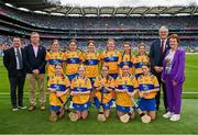 21 July 2024; The Clare team, backrow from left,  Emer Byrnes, Ballybrown NS, Clarion, Limerick, Emma McGrath, Colton NS, School Lane Colton, Louth, Ellen Bryan, Scoil Bhríde, Kill, Kildare, Biborka Benko, Clarecastle NS, Clarecastle, Annie Scullion, St Mary's PS, Portglenone, Antrim, and Mya Kane, St Patrick's, Crossmaglen, Armagh, and front row, Hannah Martyn, Carrabane NS, Athenry, Galway, Áine Nic Sheoinín, GS na Cruaiche, Cathair na Mart, Maigh Eo, Aoife Kelly, Dromore NS, Killygordon, Laci Graham, St Patrick's, Arklow, Wicklow, and Sarah O'Leary, with from left, President of Cumann na mBunscol Gary Farrell, Uachtarán an Cumann Camógaíochta Brian Molloy, Uachtarán Chumann Lúthchleas Gael Jarlath Burns and INTO President Carmel Browne, before the GAA INTO Cumann na mBunscol Respect Exhibition Go Games at the GAA Hurling All-Ireland Senior Championship final between Clare and Cork at Croke Park in Dublin. Photo by Sam Barnes/Sportsfile