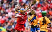 21 July 2024; Niamh McGarry, St Mary's PS, Portaferry, Down, representing Cork, in action against Emer Byrnes, Ballybrown NS, Clarion, Limerick, representing Clare, and Emma McGrath, Colton NS, School Lane Colton, Louth, representing Clare, during the GAA INTO Cumann na mBunscol Respect Exhibition Go Games at the GAA Hurling All-Ireland Senior Championship final between Clare and Cork at Croke Park in Dublin. Photo by Seb Daly/Sportsfile