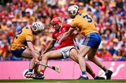 21 July 2024; Brian Hayes of Cork in action against Clare players Adam Hogan, left, and Conor Cleary during the GAA Hurling All-Ireland Senior Championship Final match between Clare and Cork at Croke Park in Dublin. Photo by Seb Daly/Sportsfile