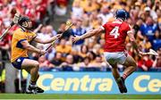 21 July 2024; Tony Kelly of Clare evades the tackle of Cork's Seán O'Donoghue on his way to scoring his side's third goal during the GAA Hurling All-Ireland Senior Championship Final match between Clare and Cork at Croke Park in Dublin. Photo by Seb Daly/Sportsfile