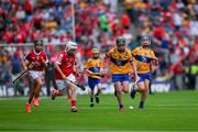 21 July 2024; James Nea, Scoil Mhuire, Loughegar, Mullingar, Westmeath, representing Clare and Cathal Lyons, Scoil Mhuire na nGael, Dundalk, Louth, representing Clare race clear of Dylan Kelly, St Brigid's NS, Bagnalstown, Carlow, representing Cork and Riain Casey, Our Lady of Mercy NS, Stradbally, Co Waterford, representing Cork during the GAA INTO Cumann na mBunscol Respect Exhibition Go Games at the GAA Hurling All-Ireland Senior Championship final between Clare and Cork at Croke Park in Dublin. Photo by Ray McManus/Sportsfile