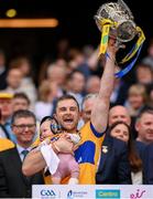 21 July 2024; Clare's Seadna Morey with his daughter Fiadhna lifts the Liam MacCarthy cup following victory in the GAA Hurling All-Ireland Senior Championship Final between Clare and Cork at Croke Park in Dublin. Photo by Stephen McCarthy/Sportsfile