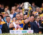 21 July 2024; Clare's Seadna Morey with his daughter Fiadhna lifts the Liam MacCarthy cup following victory in the GAA Hurling All-Ireland Senior Championship Final between Clare and Cork at Croke Park in Dublin. Photo by Stephen McCarthy/Sportsfile