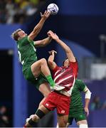 24 July 2024; Niall Comerford of Team Ireland in action against Yu Okudaira of Team Japan during the Men's Rugby Sevens Pool A match between Team Ireland and Team Japan at the Stade de France during the 2024 Paris Summer Olympic Games in Paris, France. Photo by David Fitzgerald/Sportsfile