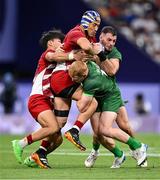 24 July 2024; Moeki Fukushi and Kippei Taninaka, left, of Team Japan in action against Gavin Mullin and Andrew Smith, right, of Team Irelandduring the Men's Rugby Sevens Pool A match between Team Ireland and Team Japan at the Stade de France during the 2024 Paris Summer Olympic Games in Paris, France. Photo by Stephen McCarthy/Sportsfile