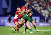 24 July 2024; Moeki Fukushi and Kippei Taninaka, left, of Team Japan in action against Gavin Mullin and Andrew Smith, right, of Team Irelandduring the Men's Rugby Sevens Pool A match between Team Ireland and Team Japan at the Stade de France during the 2024 Paris Summer Olympic Games in Paris, France. Photo by Stephen McCarthy/Sportsfile