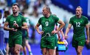 25 July 2024; Team Ireland players, from left, Andrew Smith, Hugo Lennox and Niall Comerford after the Men's Rugby Sevens Pool A match between Team Ireland and Team New Zealand at the Stade de France during the 2024 Paris Summer Olympic Games in Paris, France. Photo by Brendan Moran/Sportsfile