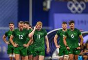 25 July 2024; Team Ireland players, from left, Niall Comerford, Gavin Mullin, Zac Ward and Chay Mullins after defeat in the Men's Rugby Sevens Quarter-Final match between Team Fiji and Team Ireland at the Stade de France during the 2024 Paris Summer Olympic Games in Paris, France. Photo by Brendan Moran/Sportsfile