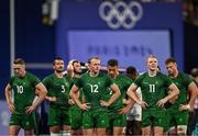 25 July 2024; Team Ireland players, from left, Terry Kennedy, Harry McNulty, Niall Comerford, Jordan Conroy and Gavin Mullin after defeat in the Men's Rugby Sevens Quarter-Final match between Team Fiji and Team Ireland at the Stade de France during the 2024 Paris Summer Olympic Games in Paris, France. Photo by Brendan Moran/Sportsfile
