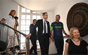 26 July 2024; Golfer Shane Lowry and 100m hurdler Sarah Lavin have been revealed as the Team Ireland flagbearers for the Opening Ceremony of the 2024 Paris Summer Olympic Games in Paris. The Irish team will wear suits designed by Irish designer Laura Weber in the ceremony that takes place later today on the River Seine in Paris. Pictured is An Taoiseach Simon Harris TD in conversation with Olympic silver medallist Kenneth Egan whilst being shown around the centre by Centre Culturel Irlandais director Nora Hickey M’Schili, right, at the Team Ireland flagbearer announcement in the Irish Cultural Centre in Paris. Photo by Sam Barnes/Sportsfile