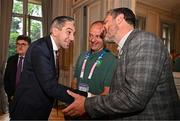 27 July 2024; An Taoiseach Simon Harris TD, left, shakes hands with Olympic silver medallist Kenneth Egan during the Irish Embassy reception at the Embassy of Ireland during the 2024 Paris Summer Olympic Games in Paris, France. Photo by Sam Barnes/Sportsfile