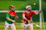 27 July 2024; Oisin Hennessy of Coolera Strandhill in action against Brian Mullins of Moytura during the CúChulainn Hurling League Connacht Divison Two final match between Coolera Strandhill and Moytura at the Connacht GAA Centre of Excellence in Bekan, Mayo. Photo by Seb Daly/Sportsfile