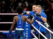 28 July 2024; Roscoe Hill of Team USA, left, celebrates with Team USA boxing coach Billy Walsh, far right, after winning his men's 51kg preliminary round of 32 bout against Omid Ahmadisafa of Olympic Refugee Team at the North Paris Arena during the 2024 Paris Summer Olympic Games in Paris, France. Photo by David Fitzgerald/Sportsfile