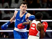 28 July 2024; Aidan Walsh of Team Ireland, left, in action against Makan Traore of Team France in their men's 71kg preliminary round of 32 bout at the North Paris Arena during the 2024 Paris Summer Olympic Games in Paris, France. Photo by David Fitzgerald/Sportsfile
