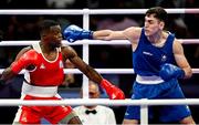 28 July 2024; Aidan Walsh of Team Ireland, right, in action against Makan Traore of Team France in their men's 71kg preliminary round of 32 bout at the North Paris Arena during the 2024 Paris Summer Olympic Games in Paris, France. Photo by David Fitzgerald/Sportsfile