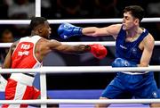 28 July 2024; Aidan Walsh of Team Ireland, right, in action against Makan Traore of Team France in their men's 71kg preliminary round of 32 bout at the North Paris Arena during the 2024 Paris Summer Olympic Games in Paris, France. Photo by David Fitzgerald/Sportsfile