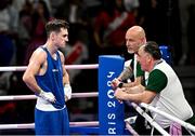 28 July 2024; Aidan Walsh of Team Ireland with  Team Ireland head coach Zaur Antia, right, and Team Ireland coach Damien Kennedy after being defeated by Makan Traore of Team France in their men's 71kg preliminary round of 32 bout at the North Paris Arena during the 2024 Paris Summer Olympic Games in Paris, France. Photo by David Fitzgerald/Sportsfile