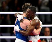 28 July 2024; Aidan Walsh of Team Ireland, left, with Makan Traore of Team France after their men's 71kg preliminary round of 32 bout at the North Paris Arena during the 2024 Paris Summer Olympic Games in Paris, France. Photo by David Fitzgerald/Sportsfile