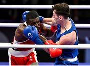 28 July 2024; Aidan Walsh of Team Ireland, right, in action against Makan Traore of Team France in their men's 71kg preliminary round of 32 bout at the North Paris Arena during the 2024 Paris Summer Olympic Games in Paris, France. Photo by David Fitzgerald/Sportsfile