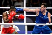 28 July 2024; Aidan Walsh of Team Ireland, right, in action against Makan Traore of Team France in their men's 71kg preliminary round of 32 bout at the North Paris Arena during the 2024 Paris Summer Olympic Games in Paris, France. Photo by David Fitzgerald/Sportsfile