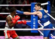 28 July 2024; Aidan Walsh of Team Ireland, right, in action against Makan Traore of Team France in their men's 71kg preliminary round of 32 bout at the North Paris Arena during the 2024 Paris Summer Olympic Games in Paris, France. Photo by David Fitzgerald/Sportsfile