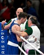 28 July 2024; Aidan Walsh of Team Ireland is consoled by Team Ireland head coach Zaur Antia, right, and Team Ireland coach Damien Kennedy after being defeated by Makan Traore of Team France in their men's 71kg preliminary round of 32 bout at the North Paris Arena during the 2024 Paris Summer Olympic Games in Paris, France. Photo by David Fitzgerald/Sportsfile