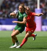 28 July 2024; Béibhinn Parsons of Team Ireland is tackled by Ellie Boatman of Team Great Britain during the Women's Rugby Sevens Pool B match between Team Ireland and Team Great Britain at the Stade de France during the 2024 Paris Summer Olympic Games in Paris, France. Photo by Stephen McCarthy/Sportsfile