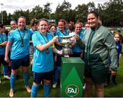28 July 2024; Terenure Rangers captain Niamh Carroll receives the cup from FAI head of women's football Hannah Dingley, after the FAI Women's Amateur Cup Final 2024 match between Whitehall Rangers and Terenure Rangers at UCD Bowl in Dublin. Photo by Michael P Ryan/Sportsfile