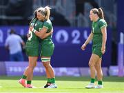 28 July 2024; Team Ireland players, from left, Amee-Leigh Murphy Crowe, Erin King, and Béibhinn Parsons after the Women's Rugby Sevens Pool B match between Team Ireland and Team Great Britain at the Stade de France during the 2024 Paris Summer Olympic Games in Paris, France. Photo by Stephen McCarthy/Sportsfile