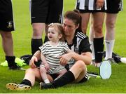 28 July 2024; Niamh Kenna of Whitehall Rangers, with daughter Sadie after the FAI Women's Amateur Cup Final 2024 match between Whitehall Rangers and Terenure Rangers at UCD Bowl in Dublin. Photo by Michael P Ryan/Sportsfile