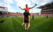 28 July 2024; Oisin O'Neill of Armagh is lifted by Armagh selector Kieran Donaghy after their side's victory in the GAA Football All-Ireland Senior Championship Final match between Armagh and Galway at Croke Park in Dublin. Photo by Harry Murphy/Sportsfile