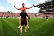 28 July 2024; Oisin O'Neill of Armagh is lifted by Armagh selector Kieran Donaghy after their side's victory in the GAA Football All-Ireland Senior Championship Final match between Armagh and Galway at Croke Park in Dublin. Photo by Harry Murphy/Sportsfile