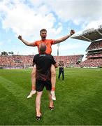 28 July 2024; Oisin O'Neill of Armagh is lifted by Armagh selector Kieran Donaghy after their side's victory in the GAA Football All-Ireland Senior Championship Final match between Armagh and Galway at Croke Park in Dublin. Photo by Harry Murphy/Sportsfile