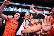 28 July 2024; Jarly Óg Burns of Armagh celebrates with his father, Uachtarán Chumann Lúthchleas Gael Jarlath Burns, after victory in the GAA Football All-Ireland Senior Championship Final match between Armagh and Galway at Croke Park in Dublin. Photo by Piaras Ó Mídheach/Sportsfile