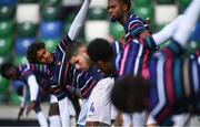28 July 2024; France players, including Yoni Gomis, centre, warm up before the UEFA European U19 Championship finals match between Spain and France at the National Football Stadium at Windsor Park, Belfast. Photo by Shauna Clinton/Sportsfile