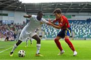 28 July 2024; Sael Kumbedi of France in action against Julio Diaz of Spain during the UEFA European U19 Championship finals match between Spain and France at the National Football Stadium at Windsor Park, Belfast. Photo by Shauna Clinton/Sportsfile