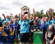 28 July 2024; Terenure Rangers captain Niamh Carroll lifts the cup after the FAI Women's Amateur Cup Final 2024 match between Whitehall Rangers and Terenure Rangers at UCD Bowl in Dublin. Photo by Michael P Ryan/Sportsfile