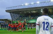 28 July 2024; A dejected Mamadou Sarr of France looks on as Spain players celebrate their victory in the UEFA European U19 Championship finals match between Spain and France at the National Football Stadium at Windsor Park, Belfast. Photo by Shauna Clinton/Sportsfile