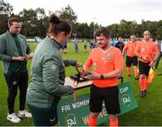 28 July 2024; Referee Eric McCann receives his medal from FAI head of women's football Hannah Dingley after during the FAI Women's Amateur Cup Final 2024 match between Whitehall Rangers and Terenure Rangers at UCD Bowl in Dublin. Photo by Michael P Ryan/Sportsfile