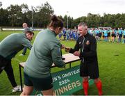 28 July 2024; Fourth official Keith White receives his medal from FAI head of women's football Hannah Dingley after during the FAI Women's Amateur Cup Final 2024 match between Whitehall Rangers and Terenure Rangers at UCD Bowl in Dublin. Photo by Michael P Ryan/Sportsfile