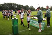 28 July 2024; Whitehall Rangers players including captain Charlie Graham recieve their runners up medals from FAI head of women's football Hannah Dingley after the FAI Women's Amateur Cup Final 2024 match between Whitehall Rangers and Terenure Rangers at UCD Bowl in Dublin. Photo by Michael P Ryan/Sportsfile