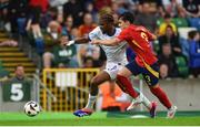28 July 2024; Steve Ngoura of France in action against Julio Diaz of Spain during the UEFA European U19 Championship finals match between Spain and France at the National Football Stadium at Windsor Park, Belfast. Photo by Shauna Clinton/Sportsfile